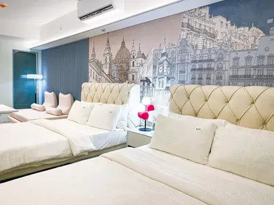 a bedroom with two beds and a mural of a city at Lovely Penthouse across City of Dreams, Airport in Manila