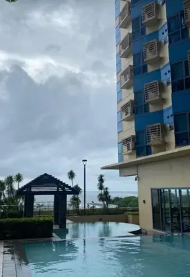 a swimming pool in front of a building at Studio type unit 1, infront of US Embassy Manila in Manila