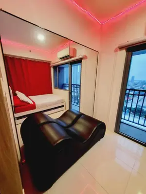 a small room with a bed and a window at Mavic Staycation in Manila