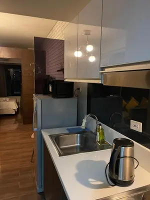 a kitchen with a sink and a counter top at Destina at Air Residences Makati MetroManila, Netflix in Manila