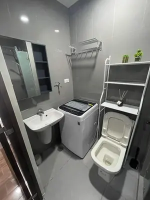 a small bathroom with a sink and a toilet at Destina at Air Residences Makati MetroManila, Netflix in Manila