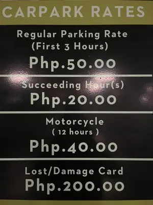 a menu of parking rates on a blackboard at Destina at Air Residence Makati, MetroManila, Netflx in Manila