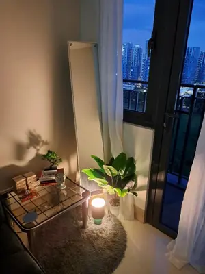 a room with a mirror and a table with a candle at Yutori Haus at Shore 3 Tower 2 near Mall of Asia Pasay City in Manila
