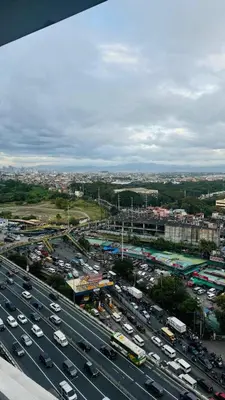 a highway filled with lots of traffic in a city at Jules Cozy StayCay II in Manila