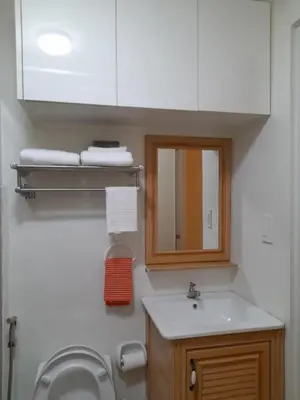 a bathroom with a sink and a mirror at Cali Suite - Nuvali in Pitland