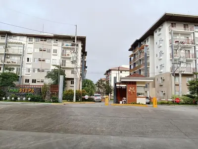 an empty parking lot in front of a building at Cali Suite - Nuvali in Pitland