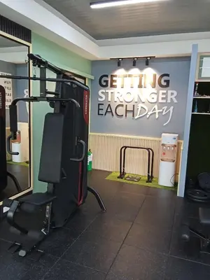 a gym with a sign that says getting stronger each day at Cali Suite - Nuvali in Pitland