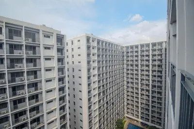 a view of two tall white buildings at Château Zen&Kat in Manila