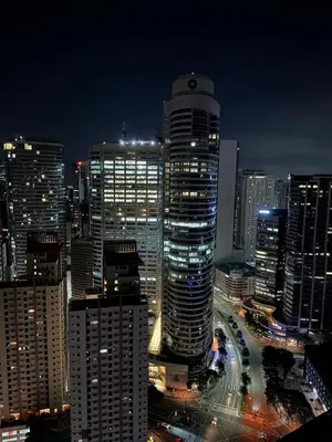 a night view of a city with tall buildings at Air Residences Apartment, Ayala Avenue Makati in Manila