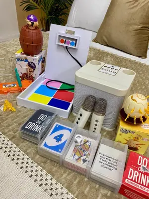 a table topped with books and other items on a bed at Azure Staycation PH in Manila