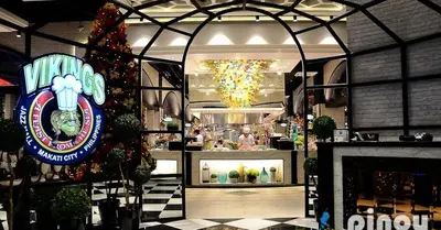 a store with a christmas tree in the middle of a room at Kate's Haven Jazz Residences Makati, Manila in Manila