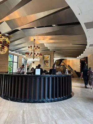 a lobby with people sitting at a bar at Prime Location Walk to Nightlife! The Gramercy in Manila