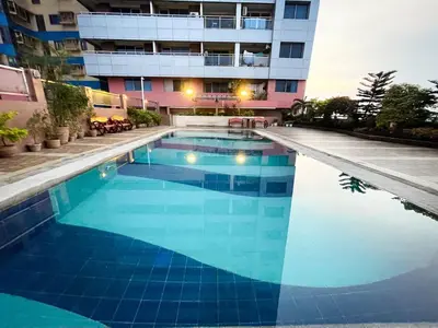a swimming pool in front of a building at Luxury Condo in Manila Bay near US Embassy in Manila