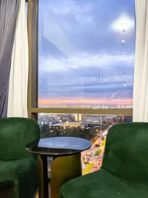 a room with a view of a city from a window at Luxury Condo in Manila Bay near US Embassy in Manila