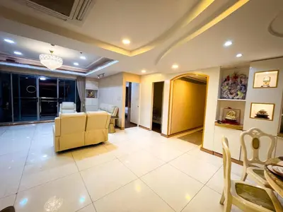 a living room with a yellow couch and a table at Stunning 3BR with Sunset View near Dolomite Beach in Manila