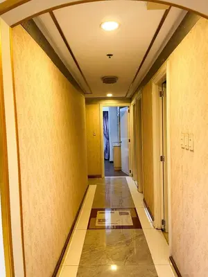 a hallway of a building with yellow walls at Stunning 3BR with Sunset View near Dolomite Beach in Manila