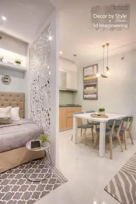 a room with a bed and a table and a dining room at Cozy in Manila