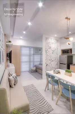 a living room with a couch and a table at Cozy in Manila