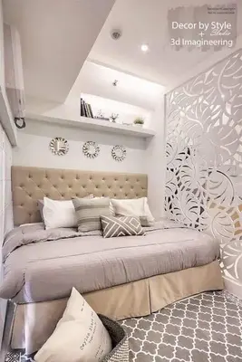 a bedroom with a large bed in a room at Cozy in Manila