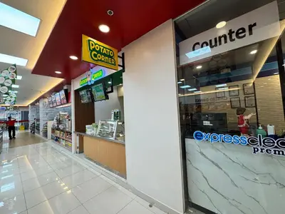 a store with a counter in a store at Deluxe Room with Parking in Red Residences Chino Roces Ave, Makati by Prime Stay in Manila