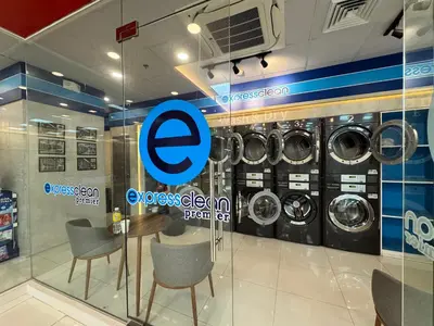 a store with a display of washing machines at Deluxe Room with Parking in Red Residences Chino Roces Ave, Makati by Prime Stay in Manila