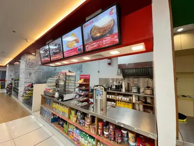a fast food restaurant with a food counter at Deluxe Room with Parking in Red Residences Chino Roces Ave, Makati by Prime Stay in Manila