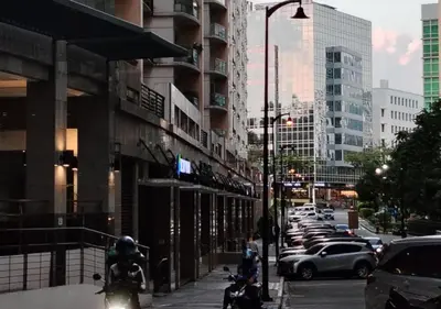 a group of motorcycles parked on a city street at Owls and Larks BnB 300mbps WiFi, Netflix, Coffee in Manila