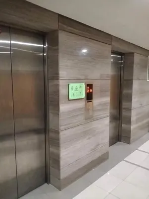 a elevator in a building with a sign on the wall at Nadzcondotel 2- at Two Palm Tree Villas o in Manila