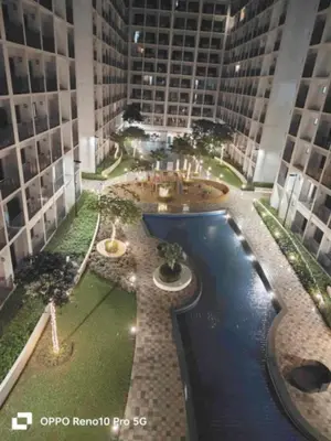 an overhead view of a building with a pool at MOA Exquisite Suite Manila by JAO's Staycation in Manila