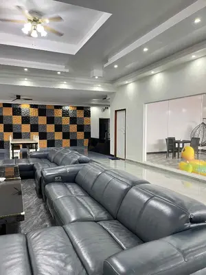 a large living room with leather couches in a room at Shiri Hotel Pool Villa 4 \uc26c\ub9ac\ud638\ud154 \ud480\ube4c\ub77c 4 in Silang
