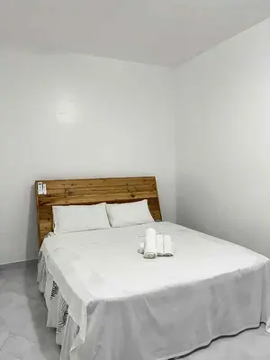 a white bed with two towels on top of it at Shiri Hotel Pool Villa 4 \uc26c\ub9ac\ud638\ud154 \ud480\ube4c\ub77c 4 in Silang