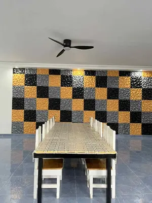 a table and chairs with a checkered wall at Shiri Hotel Pool Villa 4 \uc26c\ub9ac\ud638\ud154 \ud480\ube4c\ub77c 4 in Silang