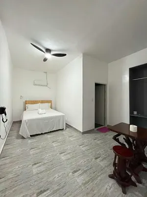 a bedroom with a bed and a flat screen tv at Shiri Hotel Pool Villa 4 \uc26c\ub9ac\ud638\ud154 \ud480\ube4c\ub77c 4 in Silang