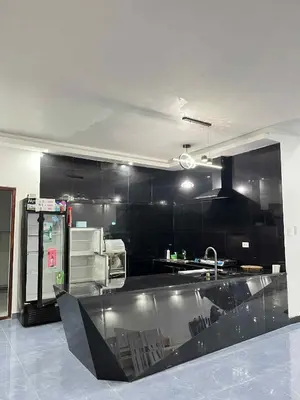 a kitchen with black walls and a stainless steel counter at Shiri Hotel Pool Villa 4 \uc26c\ub9ac\ud638\ud154 \ud480\ube4c\ub77c 4 in Silang