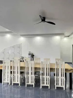 a dining room table with white chairs and a ceiling fan at Shiri Hotel Pool Villa 4 \uc26c\ub9ac\ud638\ud154 \ud480\ube4c\ub77c 4 in Silang