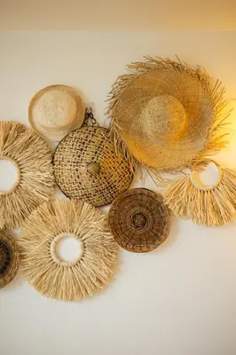 a group of straw hats on a white background at Azure Urban Resort Residences Parañaque City in Manila