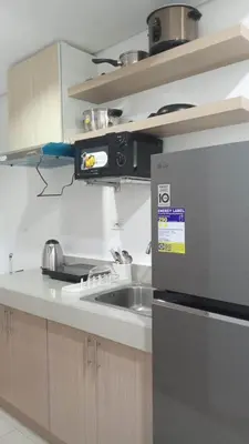 a kitchen with a sink and a microwave at 642 - Quiet & secured condo in Cavite with HI speed WIFI in Dasmariñas