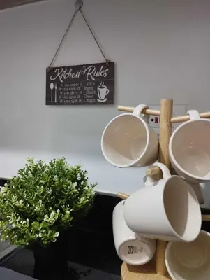 a bathroom with two toilets and a sign on the wall at Shore 2 Residences by Casa Stellar mall of Asia Complex in Manila