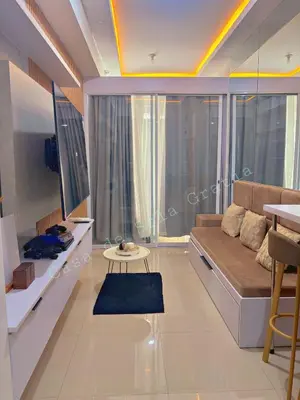 a living room with a couch and a table at Casa De Sola Gratia in Manila
