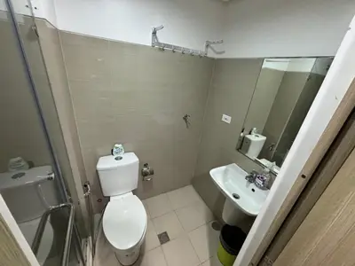 a bathroom with a toilet and a sink at MOA Home Away From Home in Manila