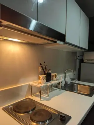 a kitchen with a sink and a counter top at Oak and Slate Oasis in Manila