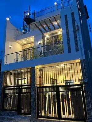 a building with gates in front of it at Casa Estela in Binangonan