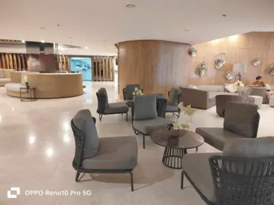 a lobby with couches and chairs and a waiting room at G Spot Manila - Mall of Asia in Manila