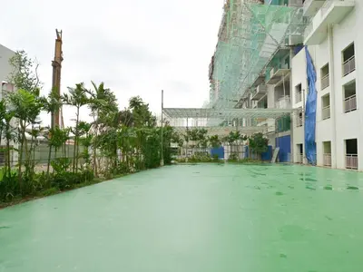 a pool of green water in front of a building at 1BR Apt in Manila