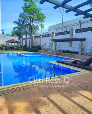 a swimming pool with blue water in a building at Studio City Alabang Pool Access Free for 2 Wifi & Netflix SC2 in Manila