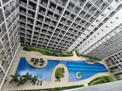 an overhead view of a large building with a swimming pool at Mall of Asia Staycation by Mochi - SMDC Shore 2 Tower 3 in Manila