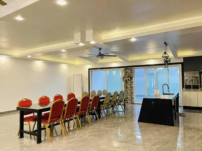 a conference room with a long table and chairs at Shiri Pool Villa 1 in Silang