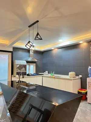 a large kitchen with a sink and a counter at Shiri Pool Villa 1 in Silang