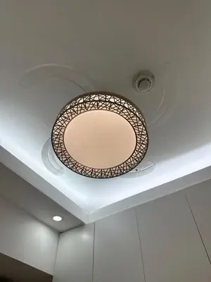 a round mirror on the ceiling of a room at Ustays in comfort and style in Manila