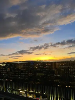a view of a city at sunset from a building at Luxurious Modern Penthouse 2BR Cross City of Dreams OKADA SOLAIRE MOA Airports in Manila